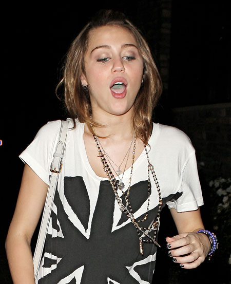 There is a picture of Miley Cyrus or at least a Miley Cyrus lookalike giving